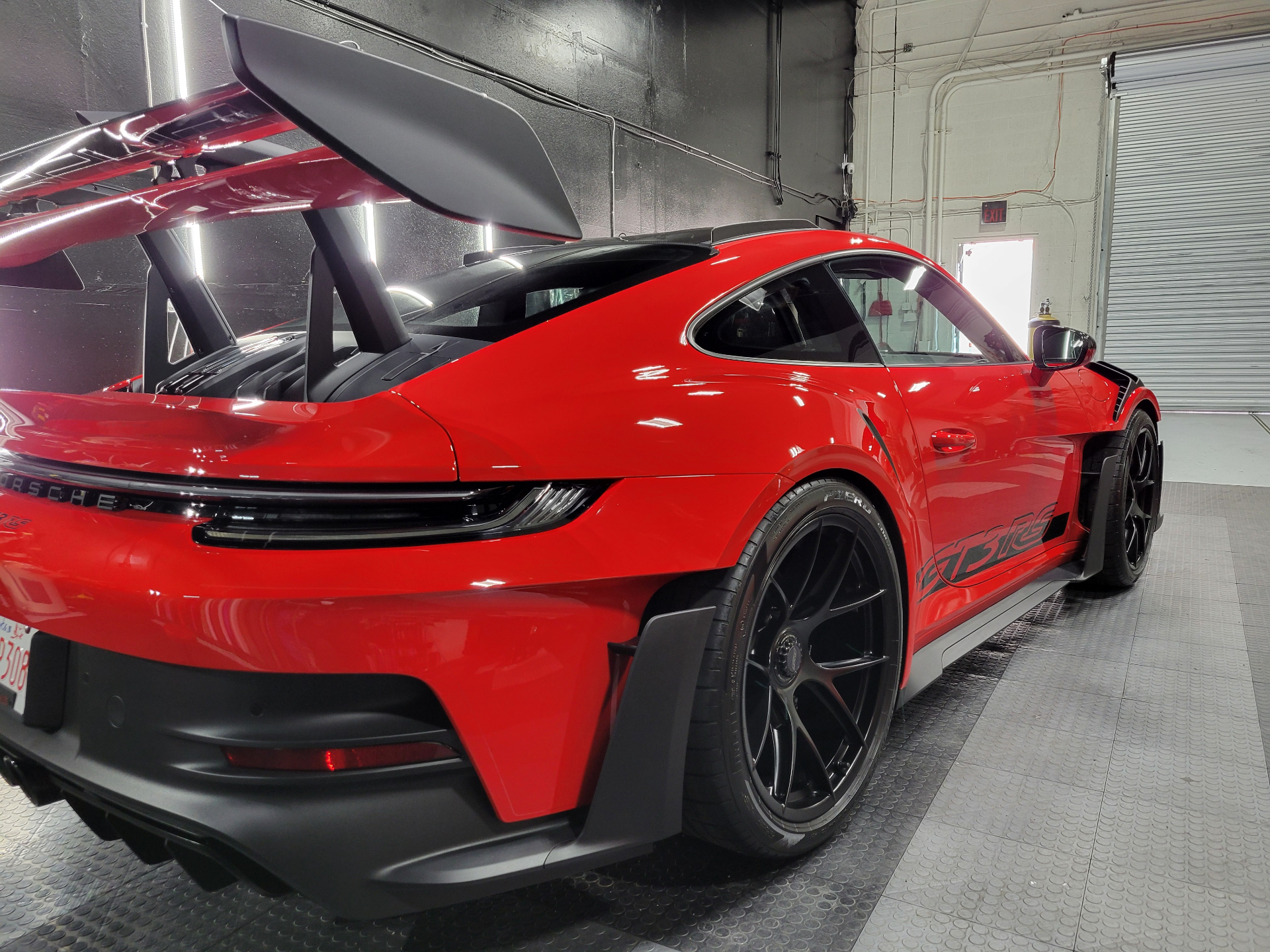 Porsche GT3 RS rear wing detail after professional ceramic coating application